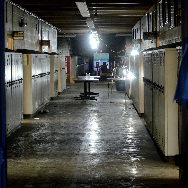 School fire: Soot covers the floor of hallway in the Norphlet High School main building after an electrical fire on Saturday morning. The school’s library and several classrooms sustained extensive damage.