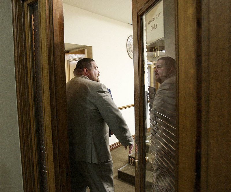 State Rep. Bob Ballinger, sponsor of the original Religious Freedom Restoration Act legislation, enters a committee room Wednesday as work begins on amending the measure. 