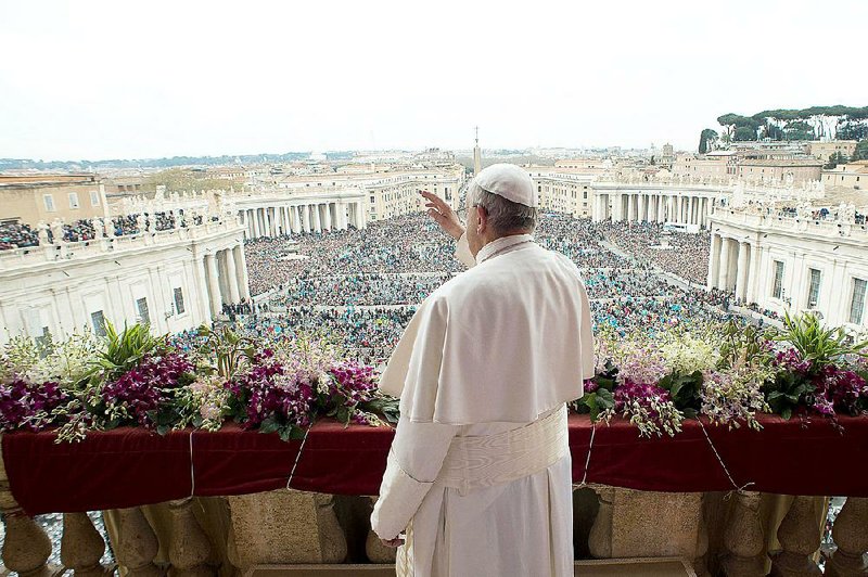 Pope Francis delivers the Urbi et Orbi (to the city and to the world) blessing at the end of the Easter Sunday Mass in St. Peter's Square at the Vatican , Sunday, April 5, 2015.  In an Easter peace wish, Pope Francis on Sunday praised the framework nuclear agreement with Iran as an opportunity to make the world safer, while expressing deep worry about bloodshed in Libya, Yemen, Syria, Iraq, Nigeria and elsewhere in Africa. Cautious hope ran through Francis' "Urbi et Orbi" Easter message, a kind of papal commentary on the state of the world's affairs, which he delivered from the central balcony of St. Peter's Square.  (AP Photo/L'Osservatore Romano, Pool)