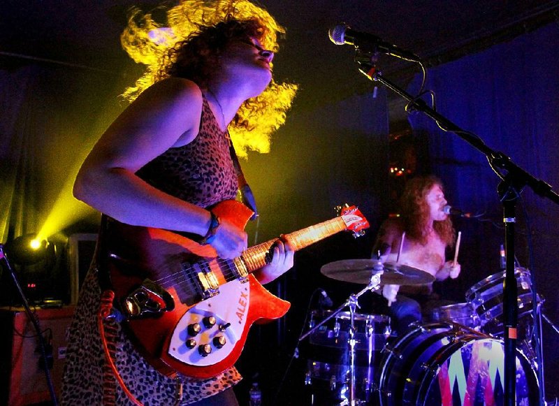 Arkansas Democrat-Gazette/CHEREE FRANCO - Alex White rocks the guitar at the Valley of the Vapors Independent Music Festival in Hot Springs. Chicago-based White Mystery consists of Alex and her brother, drummer Francis Scott Key White.