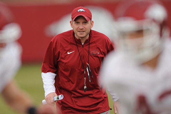 Arkansas' defensive coordinator Robb Smith directs his players during practice Saturday, Dec. 13, 2014, at the university's practice facility in Fayetteville.