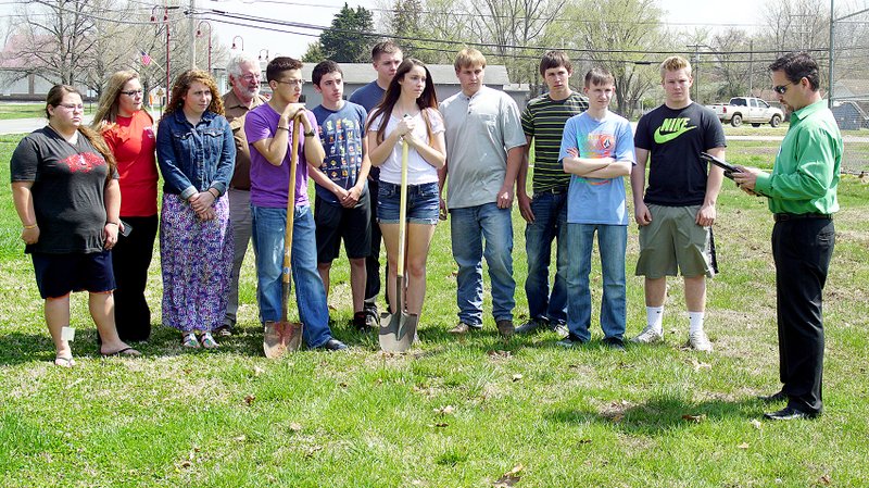 Photo by Randy Moll Gentry High School students from David Nelson&#8217;s introduction to agriculture class listened as Kevin Johnston, Gentry&#8217;s mayor, read a proclamation on March 31 in observance of Arbor Day in the city. The students came to help plant a pine tree which was to be delivered and planted in the city park. In addition to the goal of planting more trees in the park, the observance is a part of Gentry&#8217;s effort to become a Tree City.