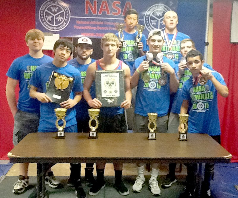 Submitted Photo Power-lifting champions were Trey Welch (front, left), Kong Lor, Kaven Flesner, James Fell, Brian Harris, Keeten Jones, Lawrence Caro, Khang Yang (back, left) and Trystan Handy.