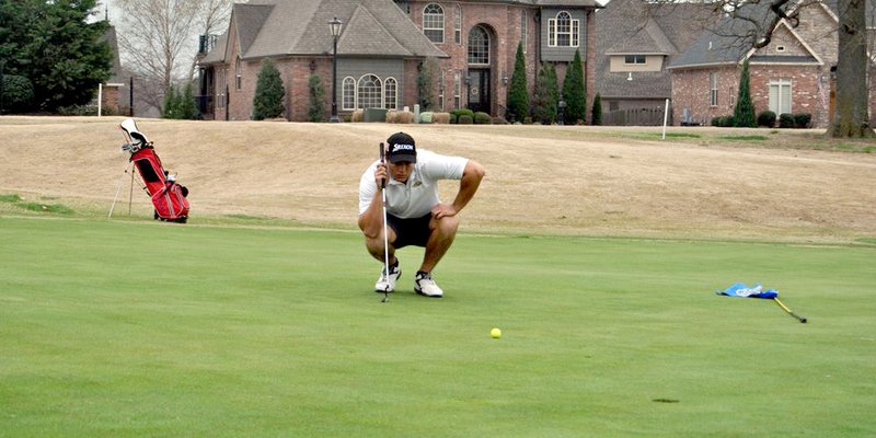 Nicholas Robinson/JBU Sports Information John Brown University junior Max Gordon lines up a putt April 1 at Shadow Valley Country Club in Rogers.