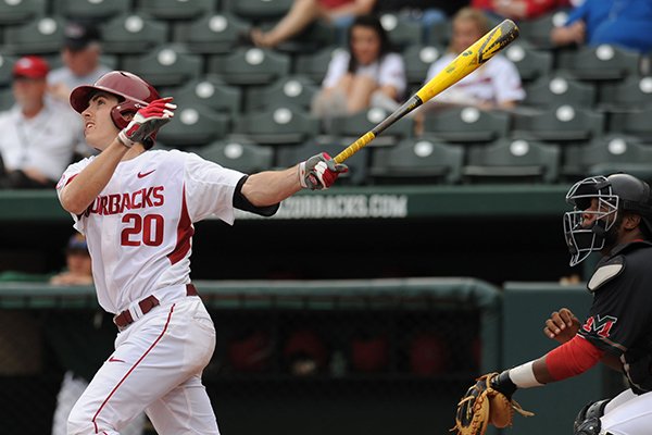 Carson Shaddy of Arkansas watches as a grand slam sails over the fence against Mississippi Valley State during the fifth inning Wednesday, April 8, 2015, at Baum Stadium in Fayetteville.