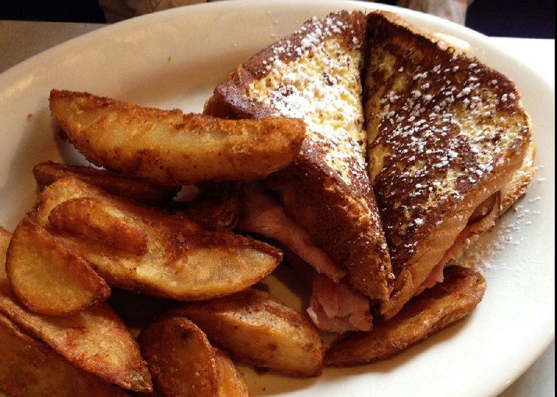 The Monte Cristo served with breakfast potatoes is a brunch option at the Purple Cow.