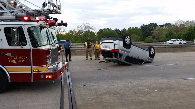 A wreck that toppled a sport utility vehicle slowed traffic Thursday, April 9, 2015, on Interstate 430 South in Little Rock.