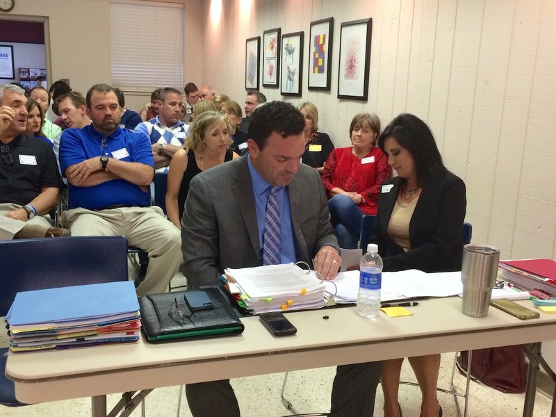 North Little Rock Football Coach Brad Bolding prepares for his appeal hearing Thursday, April 9, 2015. 