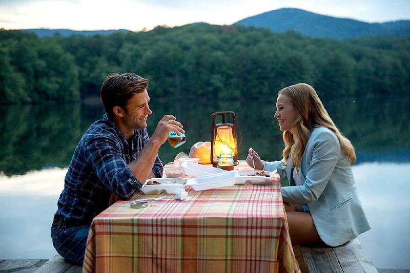 DF-17649_17599r	Luke (Scott Eastwood) and Sophia (Britt Robertson) enjoy getting to know each other while dining al fresco.  Photo credit:  Michael Tackett