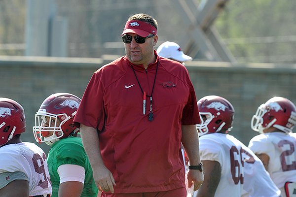 Arkansas coach Bret Bielema watches practice Tuesday, March 31, 2015, in Fayetteville. 