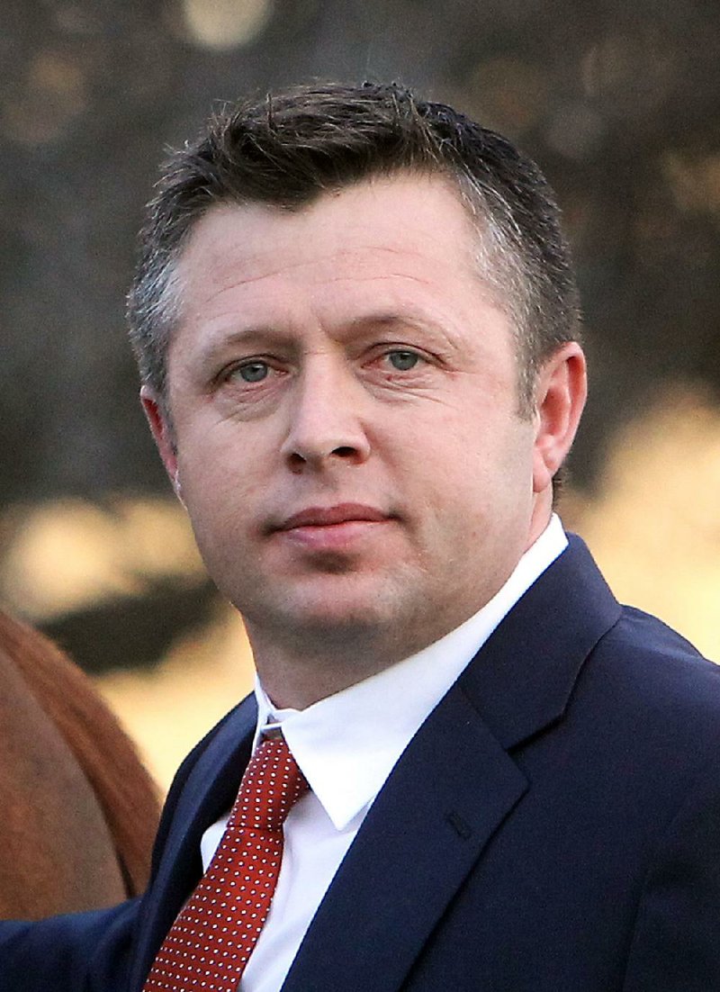 Trainer of Far Right Ron Moquett at Oaklawn Racing & Gaming Monday, January 19, 2015. (The Sentinel-Record/Richard Rasmussen)