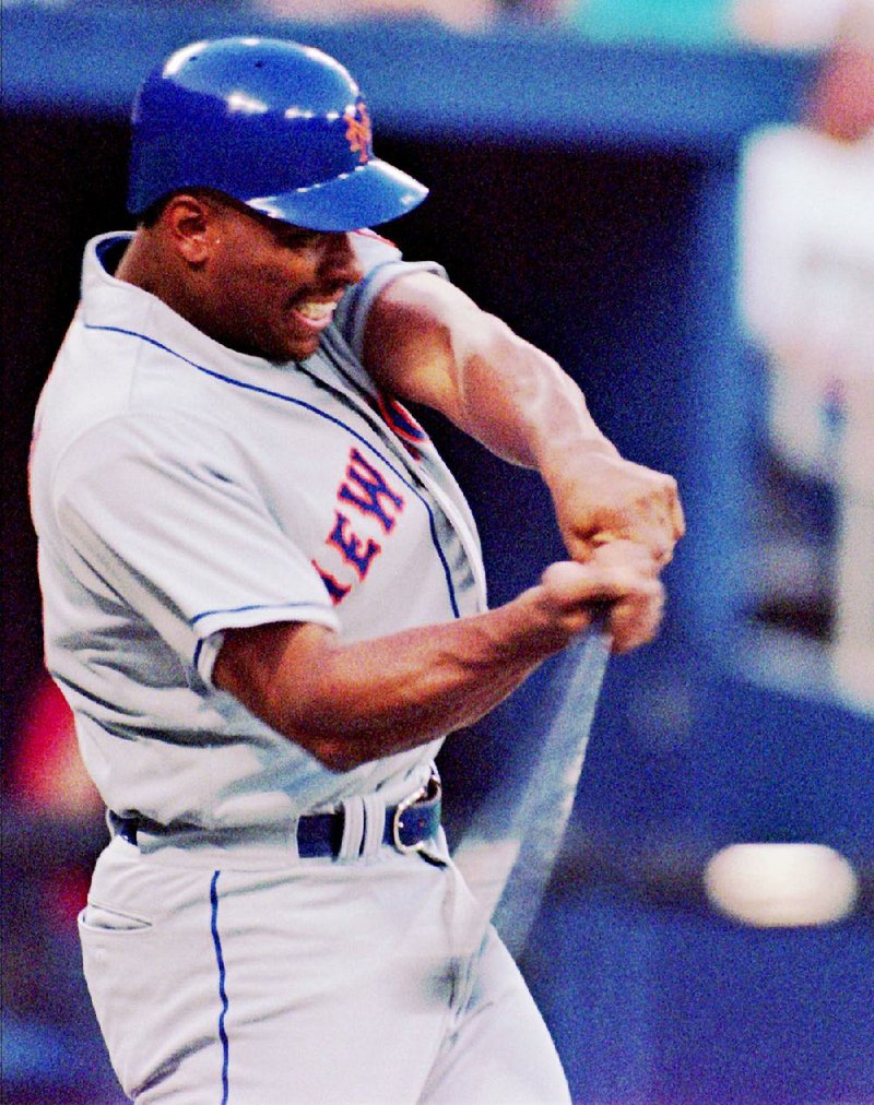 New York Mets slugger Bobby Bonilla swings at a pitch by Pittsburgh Pirates starting pitcher Denny Neagle in the fourth inning in Pittsburgh Friday, July 7, 1995. Bonilla drove the pitch over the right field wall for a home run. (AP Photo/Keith B. Srakocic)