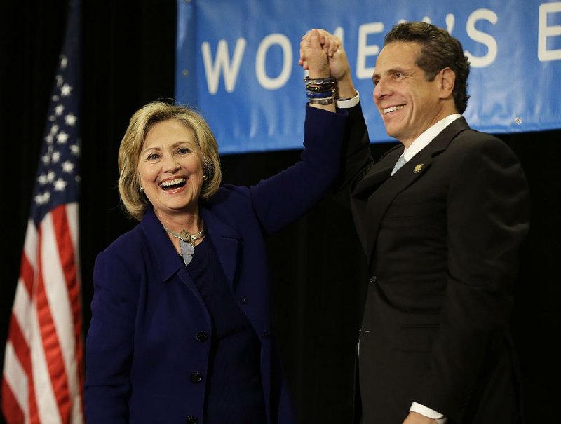 Former Secretary of State Hillary Rodham Clinton and New York Governor Andrew Cuomo acknowledge their supporters during a "Women for Cuomo" campaign event in New York, Thursday, Oct. 23, 2014. Mrs. Clinton is backing Cuomo in his bid for a second term.  Cuomo faces Republican Westchester County Executive Rob Astorino in the Nov. 4 general election. (AP Photo/Seth Wenig)