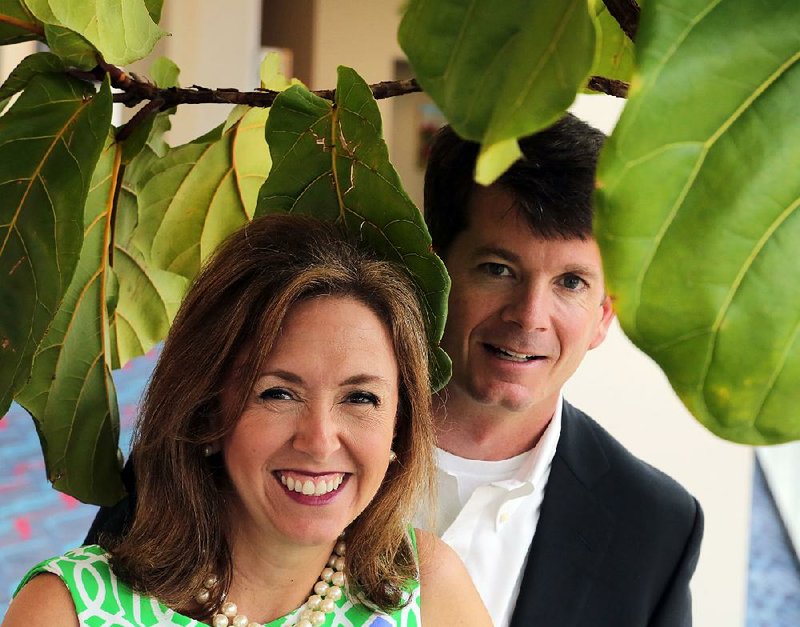 LuAnne and Rob Seay, co-chairmen for the 2015 JDRF Imagine Gala, have a little fun with the potted plants in the Statehouse Convention Center. On April 25, the place will be packed with supporters raising money for a cure. 