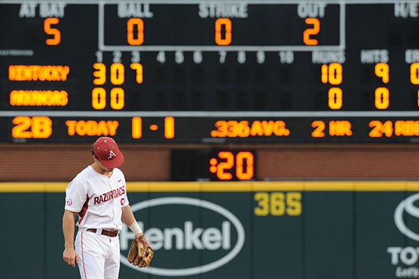 Shortstop Brett McAfee of Arkansas reacts to a 7-run Kentucky third inning Saturday, April 11, 2015, at Baum Stadium in Fayetteville.