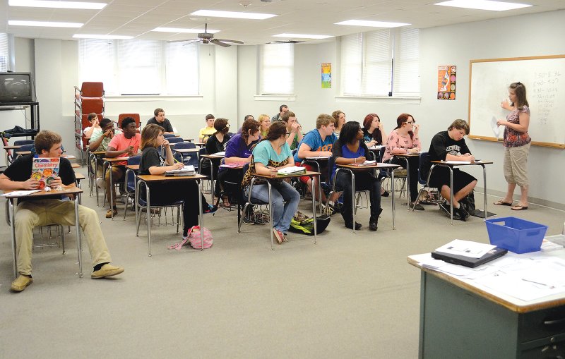 Change of scenery: Robin Boerwinkle, far right, teaches her chemisty class in the alumni room after the Norphlet High School main building was damaged in an electrical fire April 4. Boerwinkle and other Norphlet High School teachers have relocated their classes to different rooms around the high school and elementary school campus.