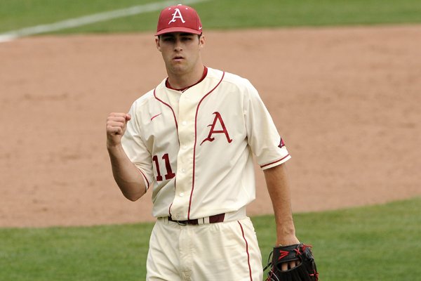 Arkansas pitcher Keaton McKinney pumps his fist in victory after the Razorbacks' 7-3 win over Kentucky on Sunday April 12, 2015. 