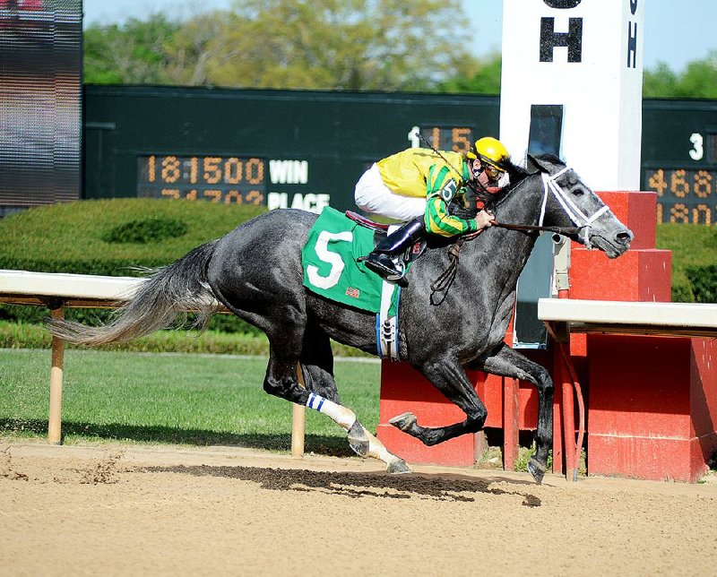 Cliff Berry rides Promise Me Silver (5) to victory Saturday in the Instant Racing Stakes at Oaklawn Park in Hot Springs. 