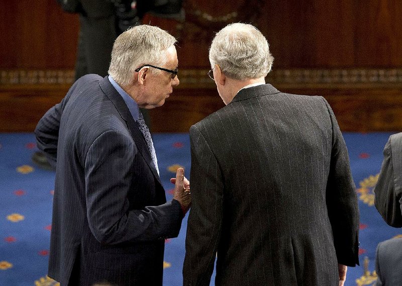 Senate Minority Leader Harry Reid (left) and Senate Majority Leader Mitch McConnell confer in late March. The Senate is racing the clock on compromise legislation for Medicare reimbursements to physicians. 