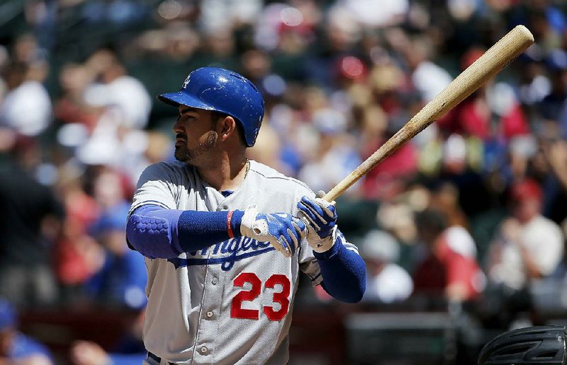 Los Angeles Dodgers' Adrian Gonzalez wais for a pitch as he bats against the Arizona Diamondbacks during the first inning of a baseball game Sunday, April 12, 2015, in Phoenix.  The Dodgers defeated the Diamondbacks 7-4. (AP Photo/Ross D. Franklin)