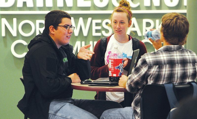 NWA Democrat-Gazette/J.T. WAMPLER Bobby Craig (from left), Kimberly Hicks and Justin Martin visit Monday in the student union at Northwest Arkansas Community College.