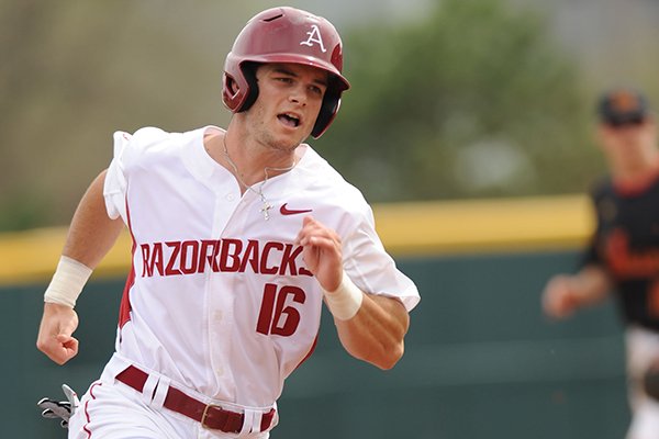 Andrew Benintendi of Arkansas heads to third base against Mississippi Valley State during the first inning Wednesday, April 8, 2015, at Baum Stadium in Fayetteville.