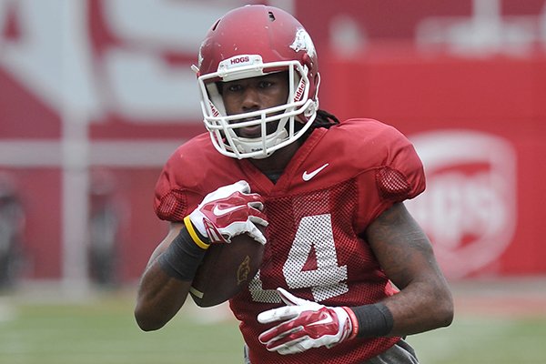 Arkansas receiver Eric Hawkins goes through practice Saturday, April 11, 2015, at Donald W. Reynolds Razorback Stadium in Fayetteville. 