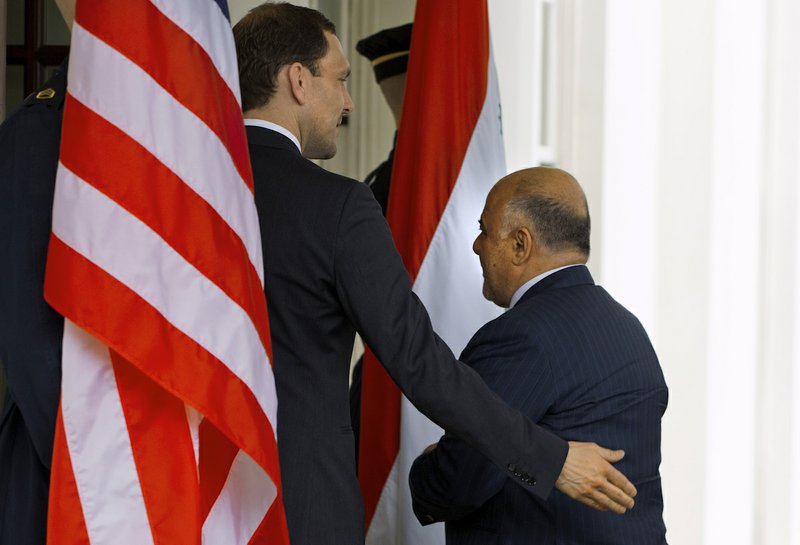 Iraqi Prime Minister Haider Al-Abadi is welcomed into the West Wing of the White House in Washington, Tuesday, April 14, 2015, for his meeting with President Barack Obama and Vice President Joe Biden. The Prime Minister’s visit is to discuss U.S.-Iraq policy and the fight against the Islamic State group. 
