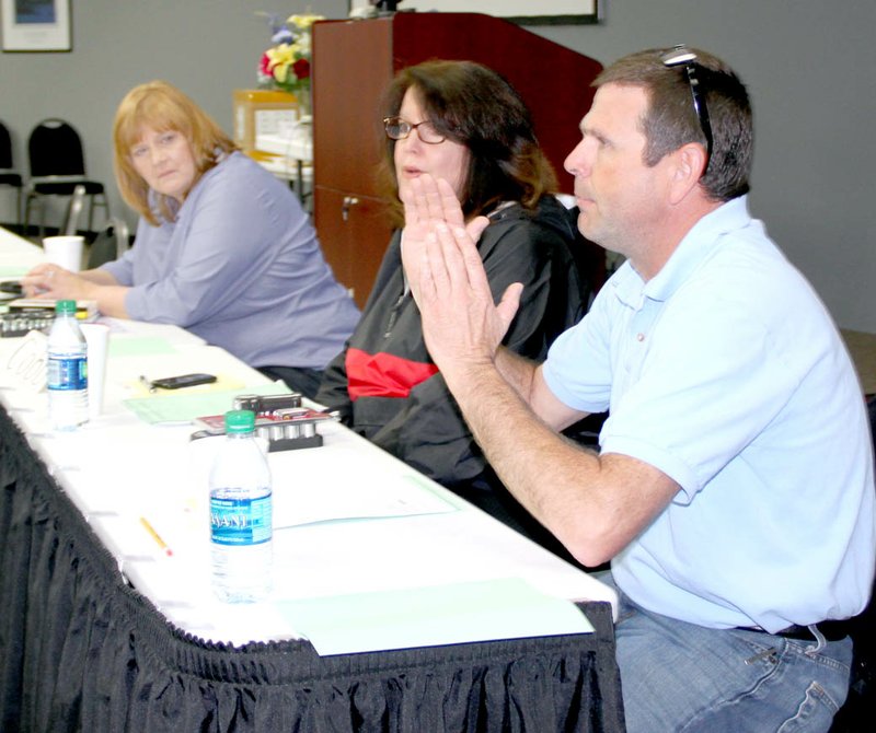 LYNN KUTTER ENTERPRISE-LEADER Clint Copeland with McKee Foods in Gentry speaks during a one-day conference recently at Northwest Arkansas Education Service Cooperative in Farmington. Educators and business leaders came together to talk about preparing students for future careers. Others on this panel were Kathy Fulks, executive director of Arkansas Construction Education Foundation in Little Rock and Susan Grimes, human resources manager with Cobb-Vantress Inc., of Siloam Springs.