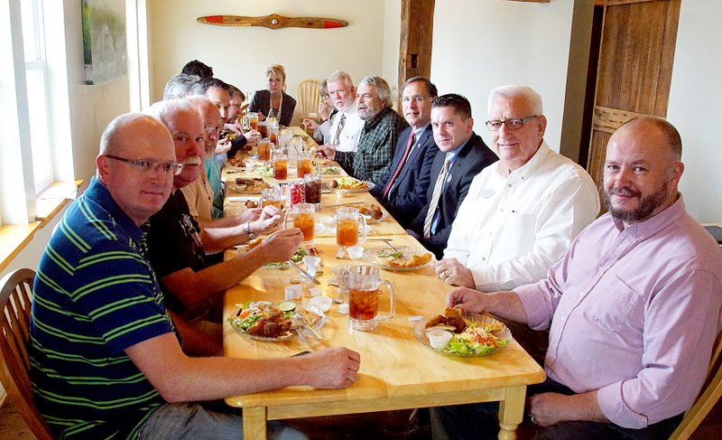 Photo by Randy Moll Mayors from Northwest Arkansas ate lunch with Senator John Boozman (right side of table, third from the end) at the Wooden Spoon Restaurant in Gentry on April 1 to discuss economic development, infrastructure and local needs.