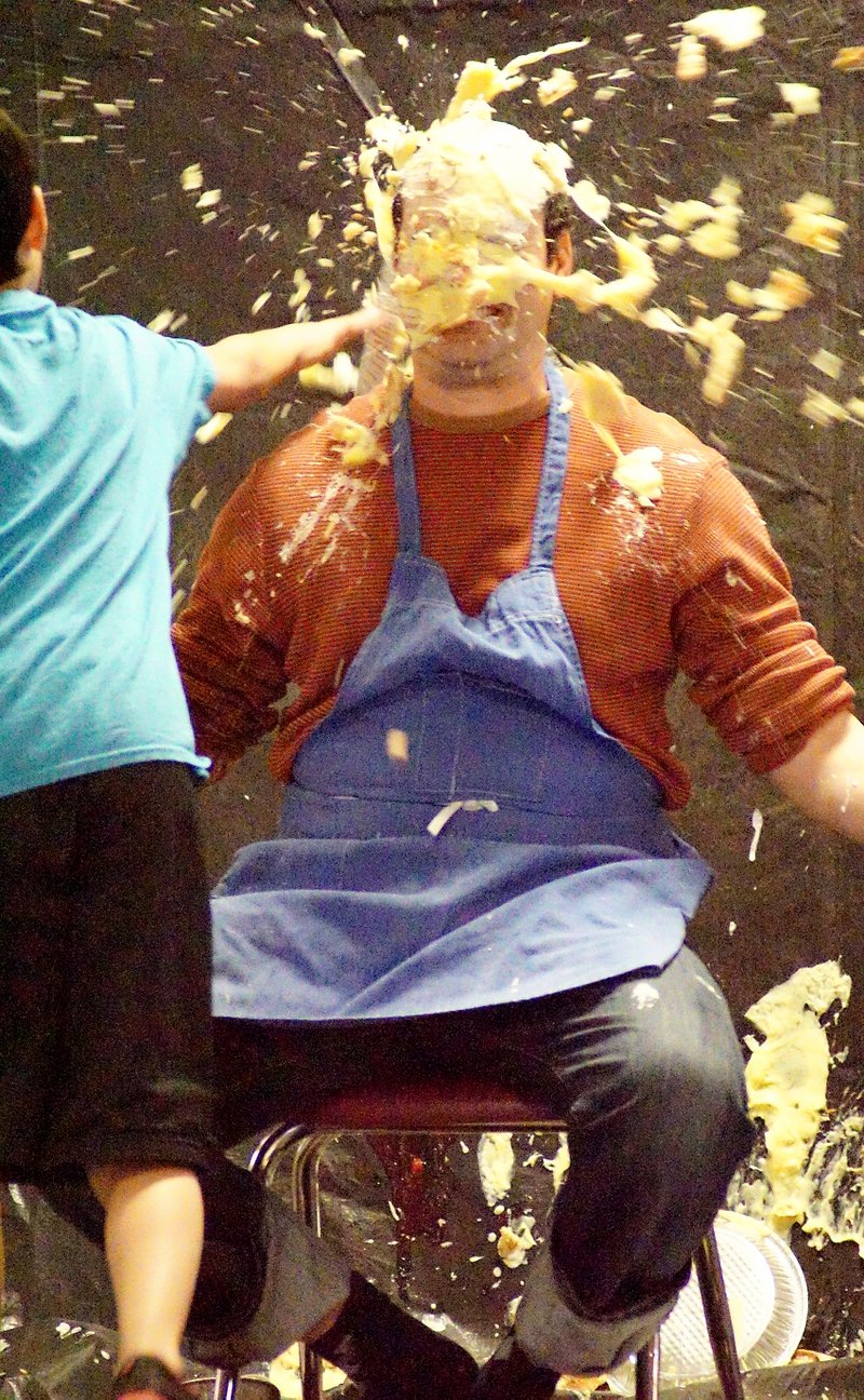 Photo by Randy Moll Taking a pie in the face for a good cause on April 3 was Gentry Intermediate School art teacher Alexander Reyes. GIS students raised more than $6,000 for the American Heart Association through the Jump Rope for Heart campaign. Several teachers, including Reyes, Cliff Smith, Leah Queen and principal Denise Waters, received a pie in the face as part of the celebration at an all-school assembly.