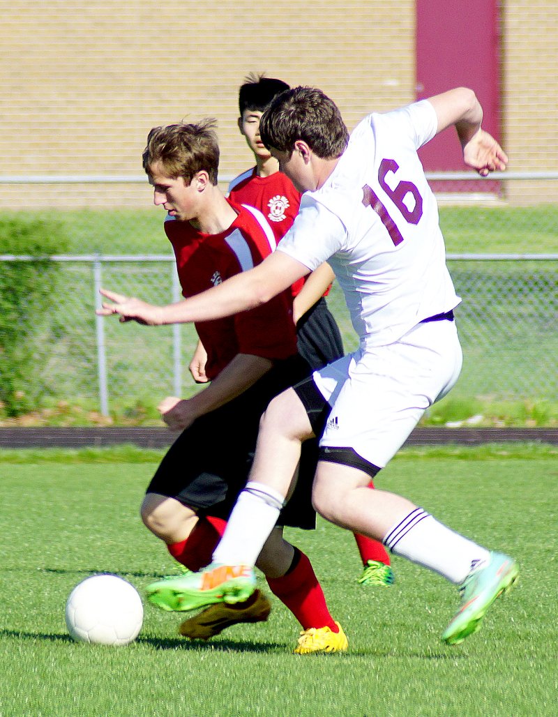 Photo by Randy Moll Kevin Easter, Gentry senior, attempted to steal the ball away from Lead Hill players on Friday at a home game in Gentry. The Gentry boys beat Lead Hill, 4-1. Jared Rabb and Aaron Walker each scored two goals. &#8203;