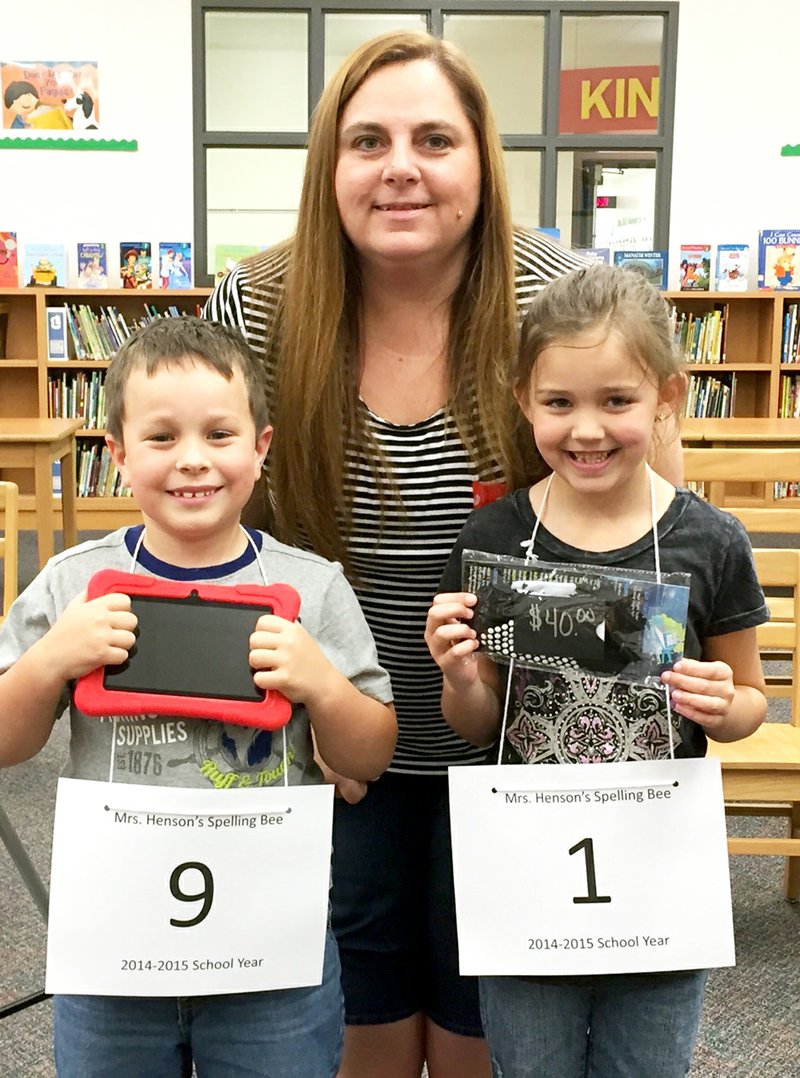 Photographs courtesy of Dawnitta Henson First place winner of the Spelling Bee was Cayden Regan, who won an android tablet. Second-place winner, Taylen Compton, received a $40 gift card to High Rise in Rogers. The two students are shown with teacher Dawnitta Henson.