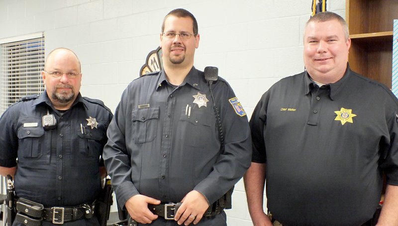 TIMES photograph by Annette Beard Police officer Tracy Reynolds and Cpl. John Langham were approved for school resource officers for the Pea Ridge schools in a cooperative agreement between the school district and city, according to Police Chief Ryan Walker.