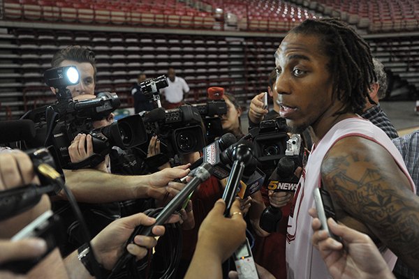 Michael Qualls speaks to reporters after announcing he was entering the NBA Draft on Wednesday, April 15, 2015, at Bud Walton Arena in Fayetteville. 