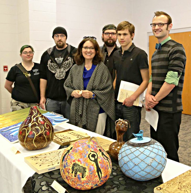 Ozarka College students pose with their projects and with Cheri McKee-McSwain, Ozarka College instructor, at the 2014 Tour D’Art. This year’s event takes place today.