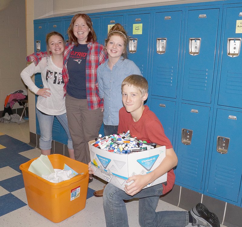 RITA GREENE MCDONALD COUNTY PRESS White Rock students Phoebe Rhamy, Joyce Pacheco (teacher), Maley Gravette, and Dakota Wynne (left to right) collect items for recycling.