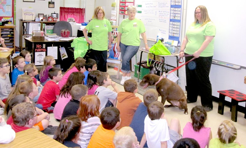COURTESY PHOTO Faithful Friends Animal Advocate team members Helen Hale, Jeanne Hale and Judy Brown and rescued dog, Kona, recently visited Anderson Elementary School.