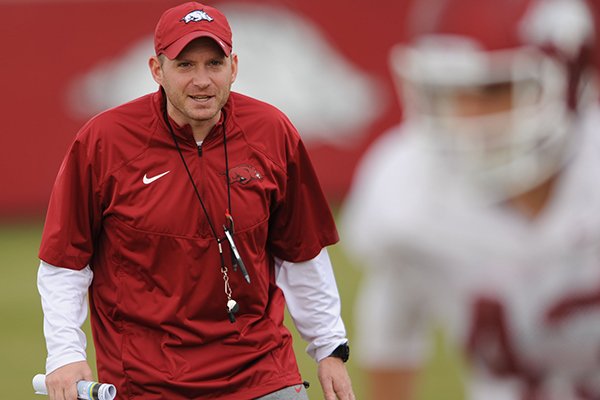 Arkansas' defensive coordinator Robb Smith directs his players during practice Saturday, Dec. 13, 2014, at the university's practice facility in Fayetteville.