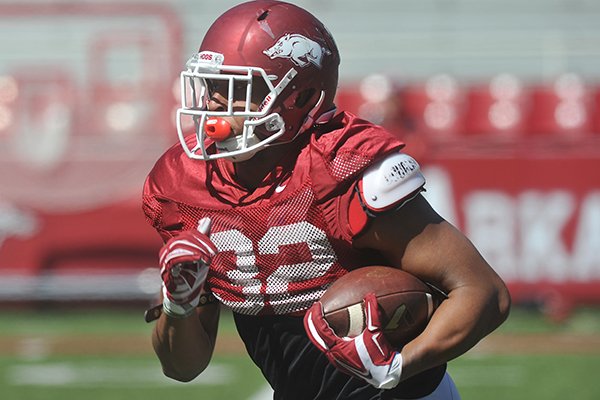 Arkansas running back Jonathan Williams carries the ball during practice Saturday, April 4, 2015, at Donald W. Reynolds Razorback Stadium in Fayetteville. 