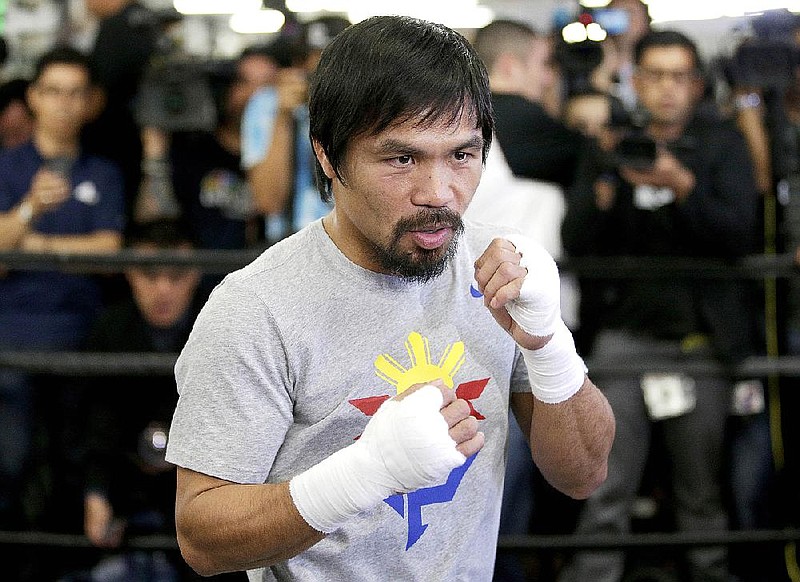 Boxer Manny Pacquiao, of the Philippines, shadow-boxes during a media workout at Wild Card Boxing Club, Wednesday, April 15, 2015, in Los Angeles. Pacquiao is scheduled to fight Floyd Mayweather Jr. in a welterweight boxing match in Las Vegas on May 2. (AP Photo/Jae C. Hong)