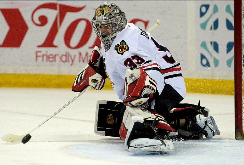 Chicago Blackhawks goaltender Scott Darling made 42 saves and did not allow a goal Wednesday night after relieving Corey Crawford in the Blackhawks’ 4-3 overtime victory over the Nashville Predators.