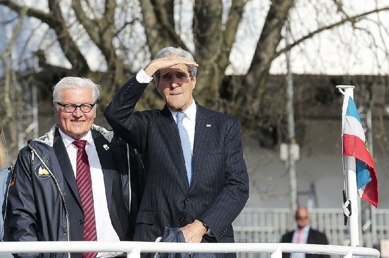 German Foreign Minister Frank-Walter Steinmeier (left) and Secretary of State John Kerry head to a Group of Seven session Wednesday in Luebeck, Germany. Kerry briefed the foreign ministers on U.S. plans for negotiations with Iran.