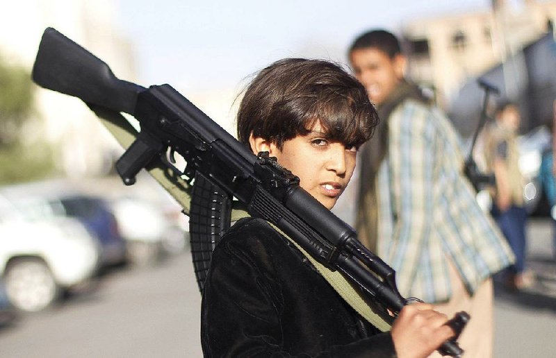 A Yemeni boy takes part in a demonstration Thursday in Sanaa against a United Nations arms embargo imposed on Houthi rebel leaders. 