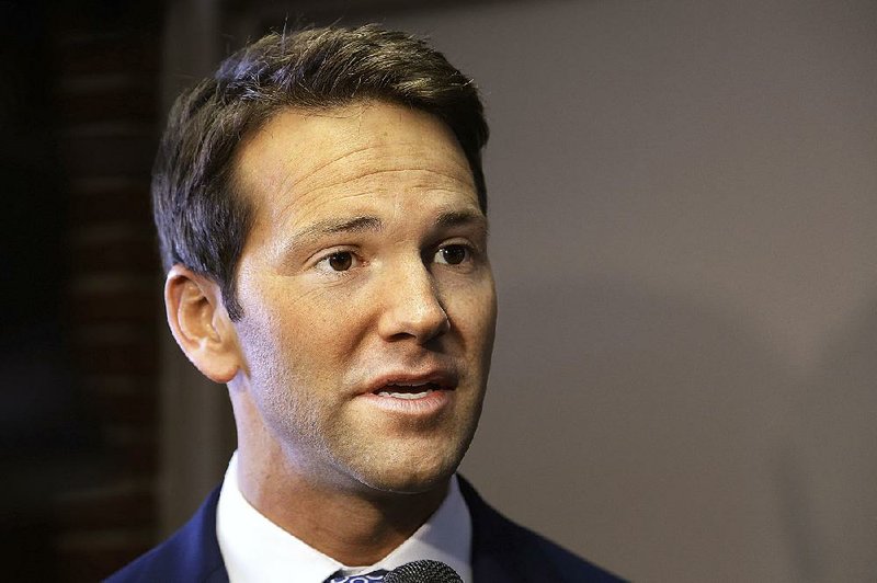  In this Feb. 6, 2015 file photo, U.S. Rep. Aaron Schock speaks to reporters in Peoria, Ill. Howard Foster, a Chicago lawyer who donated $500 to the former congressman's campaign, filed a lawsuit Wednesday, April 15, 2015, at U.S. District Court in Chicago seeking repayment of all contributions to Schock's campaign. 
