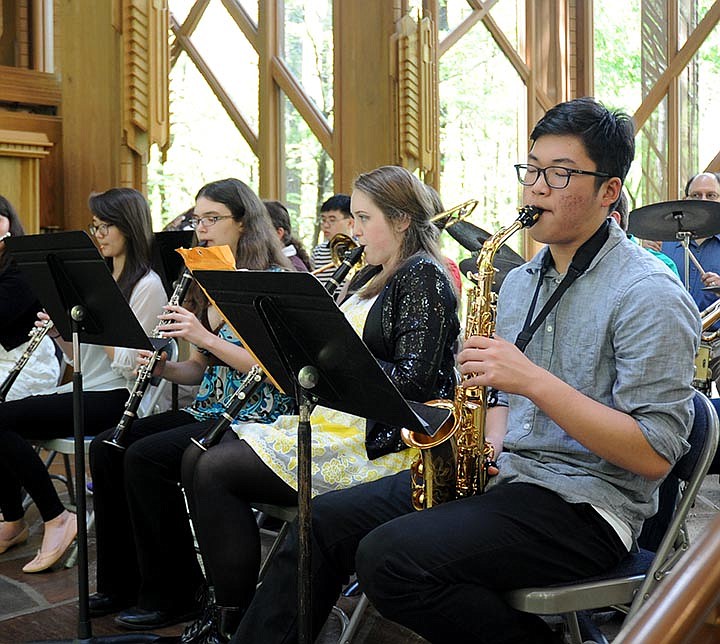 The Sentinel-Record/Mara Kuhn The Jazz and Wind Ensemble from the Arkansas School for Mathematics, Sciences, and the Arts performed at Anthony Chapel at Garvan Woodland Gardens on Wednesday in celebration of the school's 20th anniversary. The informal concert sent melodies floating through the sun-soaked gardens after scattered showers earlier in the day.