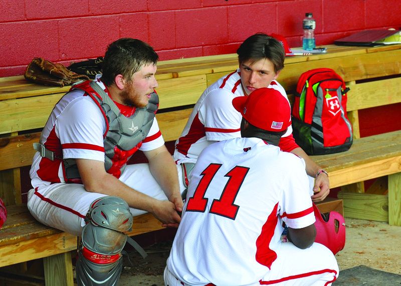 Talking it over
Camden Fairview players, from left, Jerry Bever, Jordan Semple and DJ Franklin (11) sit in the home dugout and talk strategy during a recent game at Camden Yards. On Thursday, the Cardinals swept a conference doubleheader from DeQueen.