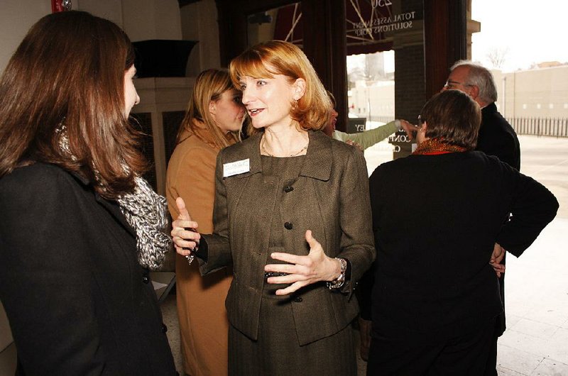 Heather Larkin, center, speaks to Brooke Ivy of the Museum of Discovery at the Arkansas Community Foundation press conference announcing its first Arkansas Gives Day slated for April 2, 2015.