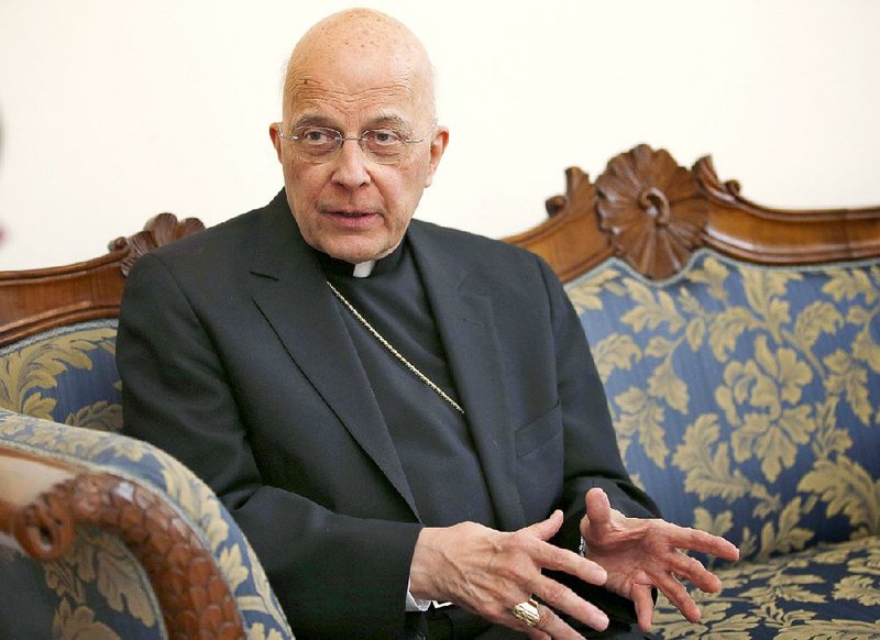 In this March 14, 2013 file photo, Cardinal Francis George speaks during an interview at the North American College in Rome. George, a vigorous defender of Roman Catholic orthodoxy who led the U.S. bishops' fight against Obamacare and played a key role in the church's response to the clergy sex abuse scandal, has died. 