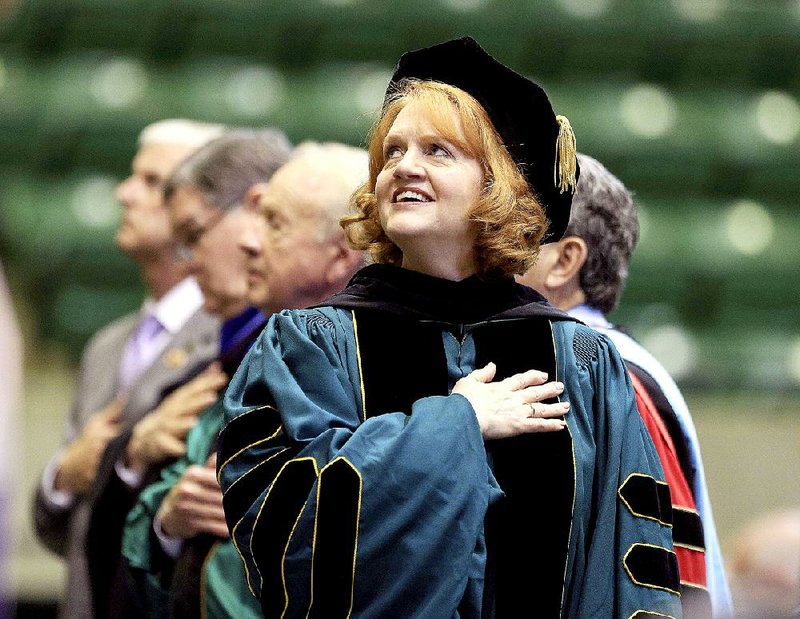 FILE — Arkansas Tech University President Robin Bowen joins the singing of the national anthem during her inauguration ceremony at the Russellville campus in this file photo.